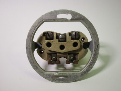 Socket without the front faceplate. The terminals can be seen.
