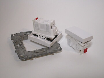 Switch modules laid on top of a frame.