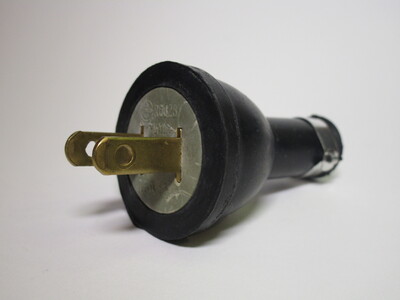 Side view of the plug, it's made out of black rubber.