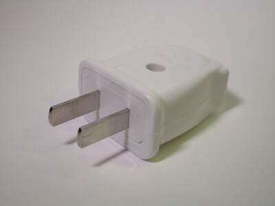 Plug, made of white glossy plastic.
