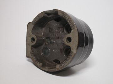 Rear of the socket. One of the cable entry sections has been chipped away.